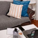 Living room with laptop setup on coffee table